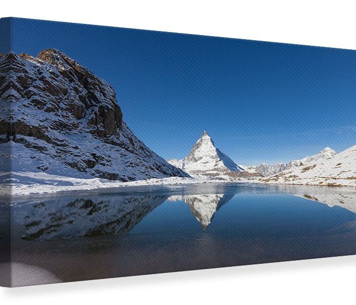 Leinwandbild Blau-Der-Riffelsee-am-Matterhorn Querformat